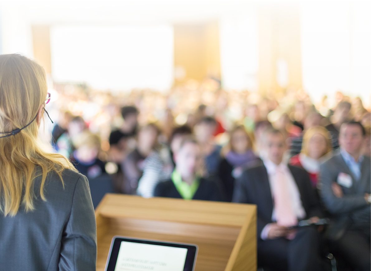 Female speaker at Business Conference and Presentation. Audience at the conference hall. Business and Entrepreneurship. Business woman.