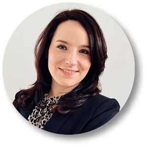 A woman wearing a black jacket and a leopard print shirt. Description generated by AI